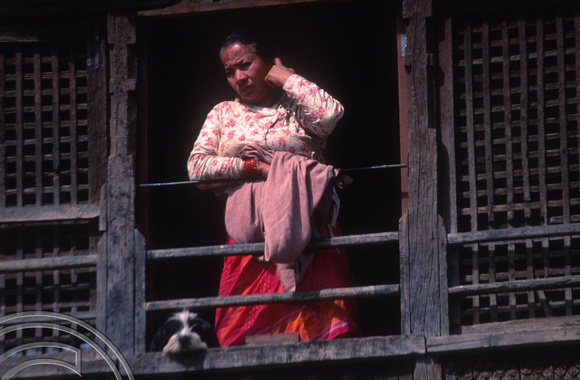 T03271. Woman at a window. The Monkey Temple. Kathmandu. Nepal. 12th March 1992