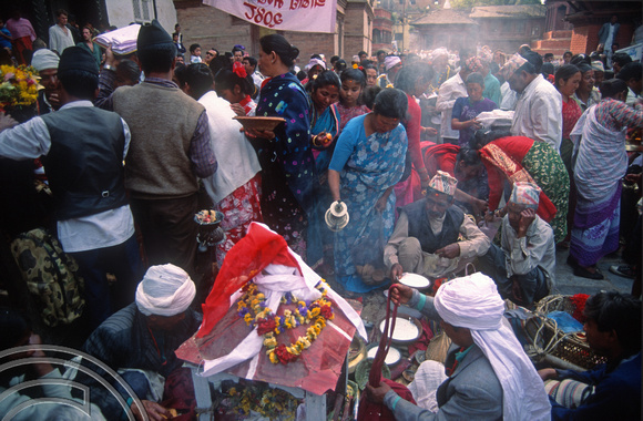 T03367. Making offerings at a festival in Durbar Square. Kathmandu. Nepal. March 1992