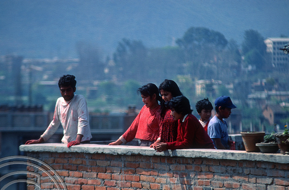 T03326. Nepali family having fun on Holi. Thamel. Kathmandu Valley. Nepal. 18th March 1992