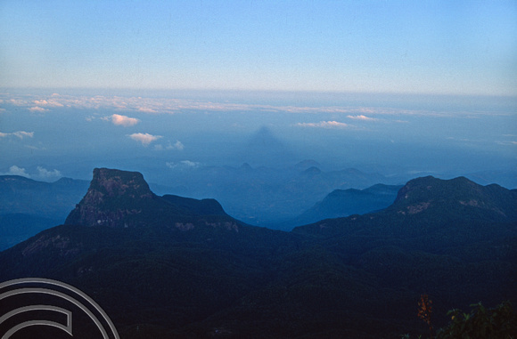 T03196. Peak shadow seen at sunrise on Adam's Peak. Sri Lanka. February 1992.