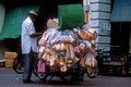 T04150. Selling bread from a scooter. Chinatown. Kuala Lumpur. Malaysia. 8th October 1992