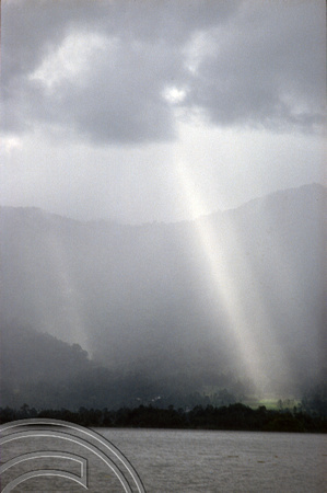T03868. Sunbeam through the clouds over the lake. Maninjau. West Sumatra. Indonesia. 25th June 1992