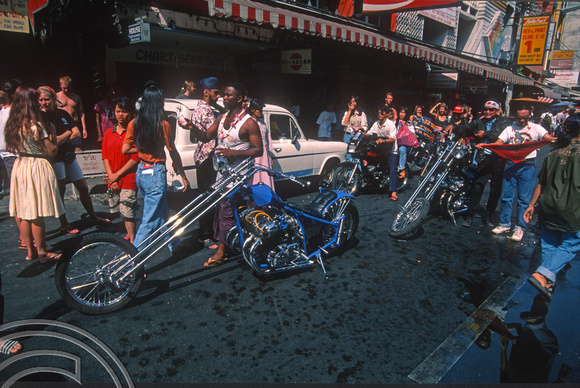 T03393. Motorcycles parading. Khao San Rd. Bangkok. Thailand.  12th April 1992