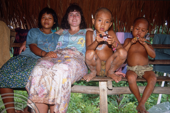 T03761. Sue with Mentawai family. Siberut. Mentawai Islands. Indonesia. June 1992