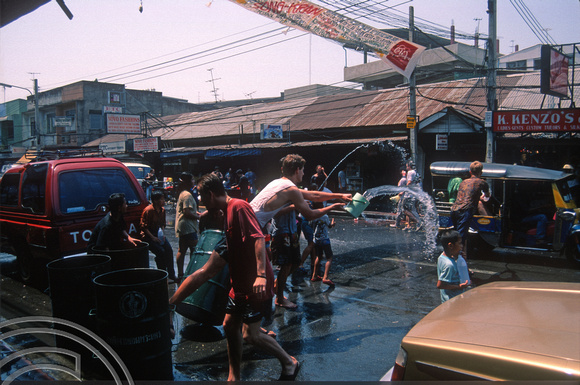 T03404. Songkran water festival. Khao San Rd. Bangkok. Thailand.  12th April 1992
