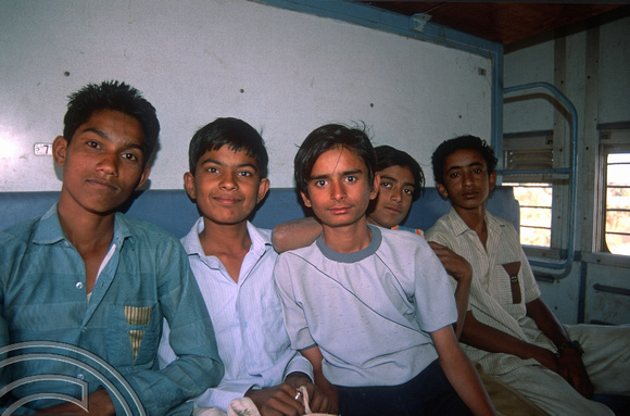 T02968. Students on the train from Jodhpur to Jaisalmer. Rajasthan. India. 2nd November 1991