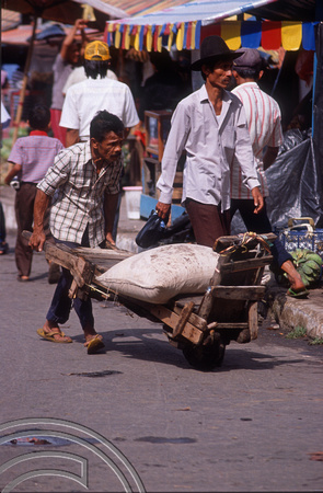 T03635. Man with wheelbarrow. The market. Bukittinggi. West Sumatra. Indonesia. 3rd June 1992