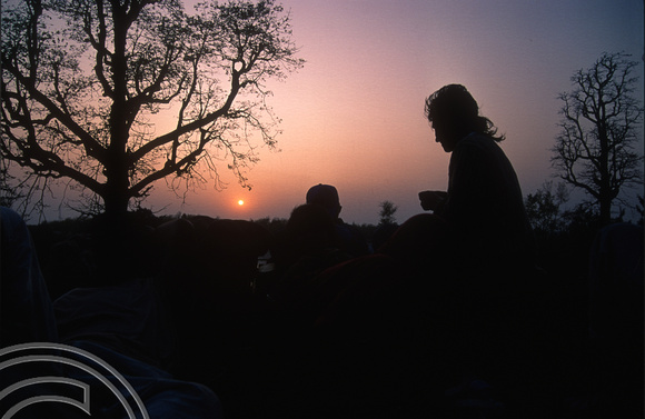 T03253. Sunset from the roof of a bus. The Terai. Nepal. 8th March 1992.