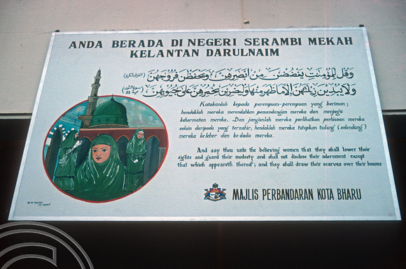 T03540. Bus station sign promoting modesty. Kota Baru. Kelantan. Malaysia. 12th May 1992