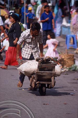 T03636. Man with wheelbarrow. The market. Bukittinggi. West Sumatra. Indonesia. 3rd June 1992