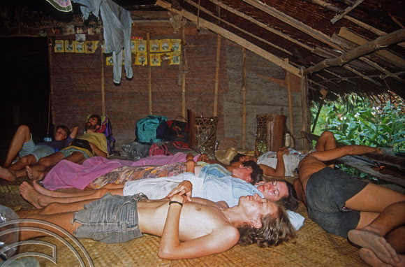 T03800. Asleep on the floor. Siberut. Mentawai Islands. Indonesia. 19th June 1992