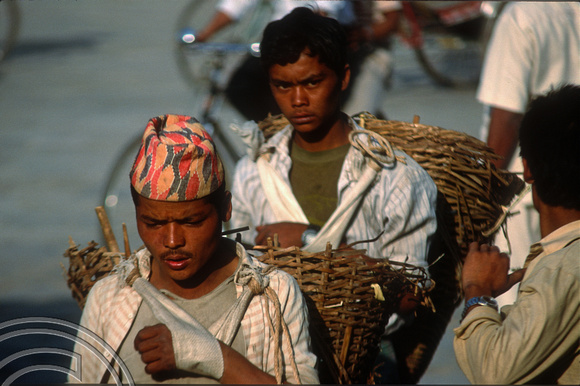 T03358. Porter in Durbar Square. Kathmandu. Nepal. March 1992