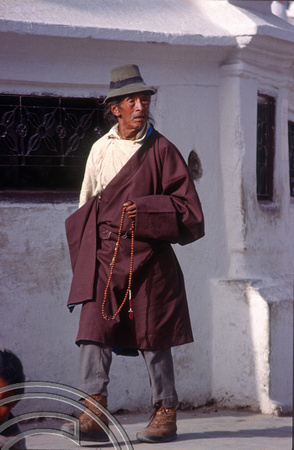T03314. Tibetan man at the Stupa. Bodnath. Kathmandu Valley. Nepal. 14th March 1992