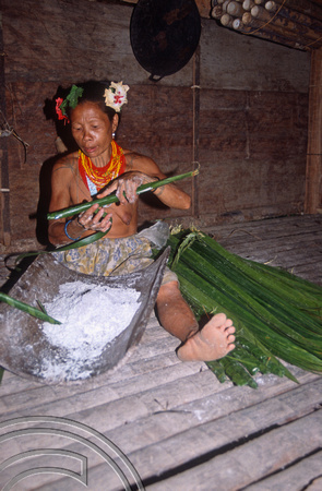 T03802. Woman preparing to bake sago. Mentawai Islands. Indonesia. 21st June 1992