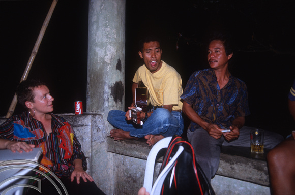 T04114. Playing guitar in Teddy's Bar. Kupang. Timor. Indonesia. 14th September 1992