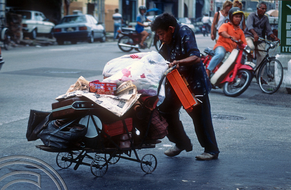 T03512. Homeless person. Lebuh Chulia. Georgetown. Penang island. Malaysia. 5th May 1992