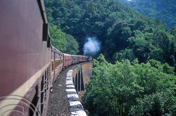 T3081.Vasco-Bangalore train banked by a steam engine 30154. Dudhsagar. Goa. India. December 1991