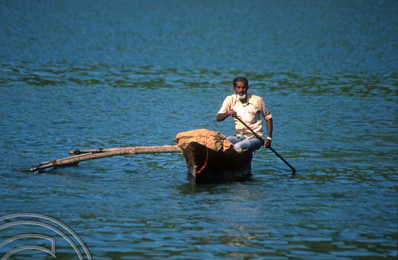 T03074. Canoeing across the Terekol river. Pernem. Goa. India. December 1991.
