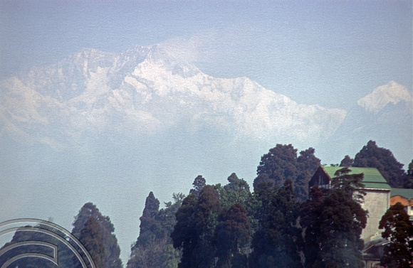 T03250. Kanchenjunga seen through the haze. Darjeeling. West Bengal. India. 2nd March. 1992.