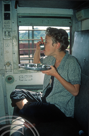 T03087. Wendy eating on the Vasco-Bangalore train. Goa. India. December 1991.