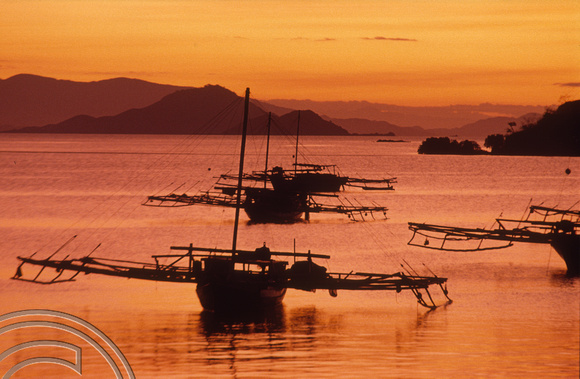 T04056. Sunset over the harbour. Labuanbajo. Flores. Indonesia. 5th September 1992.