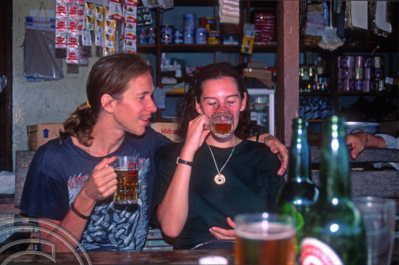 T03827. Steve and Jo enjoy a beer. Siberut. Mentawai Islands. Indonesia. 22nd June 1992