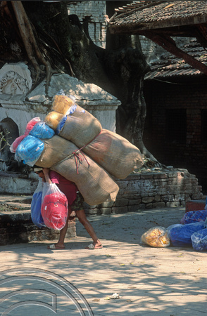 T03350. Porter in Durbar Square. Kathmandu. Nepal. March 1992
