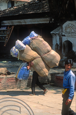 T03351. Porter in Durbar Square. Kathmandu. Nepal. March 1992