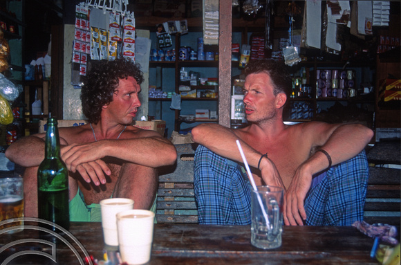 T03828. Franz and Mark enjoy a beer. Siberut. Mentawai Islands. Indonesia. 22nd June 1992