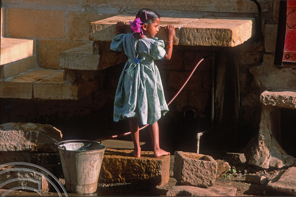 T02990. Girl fetching water. Jaisalmer. Rajasthan. India. 3rd November 1991