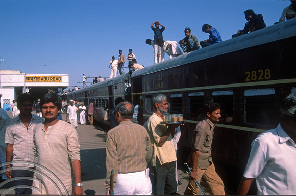 T03030. People on the roof of the train. Abu Road. Gujarat. India. 11th November 1991