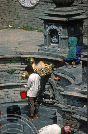 T03348. Collecting water at a public fountain. Kathmandu. Nepal. March 1992