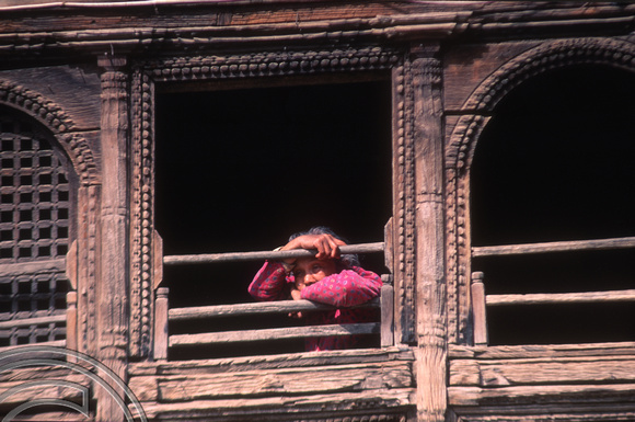 T03269. Woman at a window. The Monkey Temple. Kathmandu. Nepal. 12th March 1992