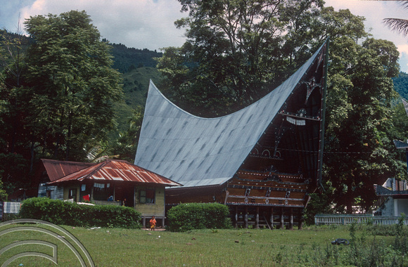 T03593. Batak house. Tomok. Samosir Island. Lake Toba. North Sumatra. Indonesia. 23rd May 1992