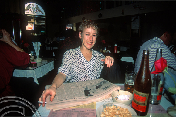 T03063. Wendy in Leopold's Bar. Mumbai. Maharastra. India. December 1991