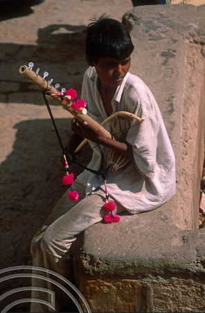 T02983. Young busker in the fort. Jaisalmer. Rajasthan. India. 3rd November 1991