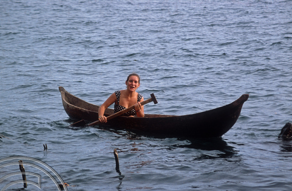 T03678. Tina canoeing in the lake. Lake Meninjau. West Sumatra. Indonesia.  8th June 1992