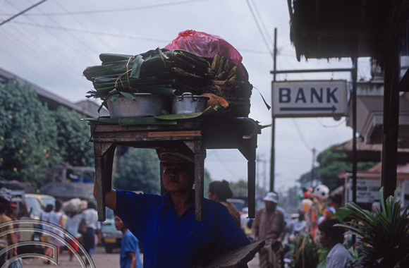 T03982. Women carrying her stall. Ubud. Bali. Indonesia. August 1992