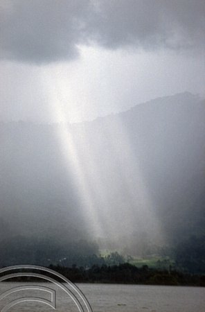 T03869. Sunbeam through the clouds over the lake. Maninjau. West Sumatra. Indonesia. 25th June 1992