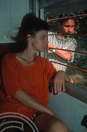 T03065. Woman and admirer on the train to Goa. Karnataka. India. December 1991.