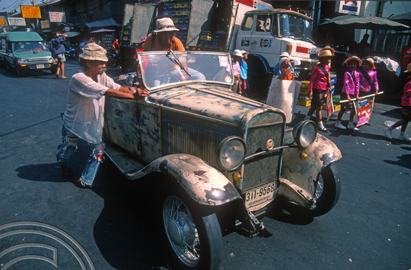 T03396. Vintage car. Parade. Khao San Rd. Bangkok. Thailand.  12th April 1992