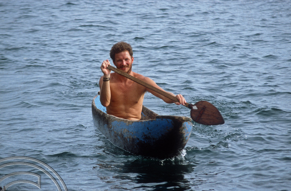 T03677. Mark canoeing in the lake. Lake Meninjau. West Sumatra. Indonesia.  8th June 1992