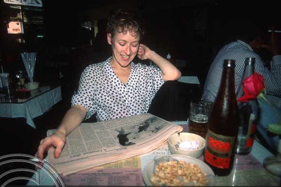 T03062. Wendy in Leopold's Bar. Mumbai. Maharastra. India. December 1991
