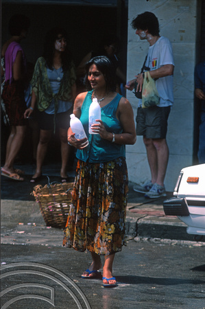 T03413. Songkran water festival. Spot the snake. Khao San Rd. Bangkok. Thailand.  12th April 1992