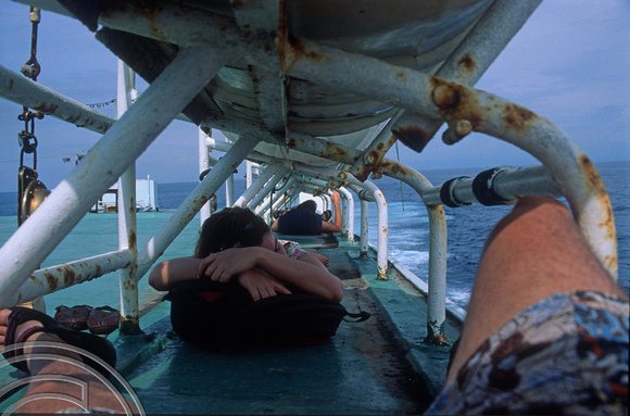 T4807. Dozing on the early morning ferry to Lombok. Padangbai. Bali. 14th December. 1994. jpg