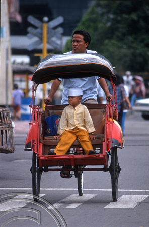 T8344. Boy in a bacak. Yogyakarta. Java. Indonesia. November.1998
