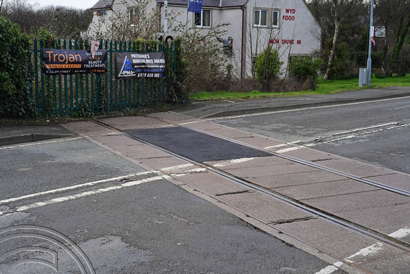 DG340112. Closed railway. A5025 crossing. Amlwych. Anglesey. Wales. 23.2.20.
