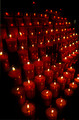 T15326. Candles burning in the local church. Pals. Catalonia. Spain. 19.04.2003
