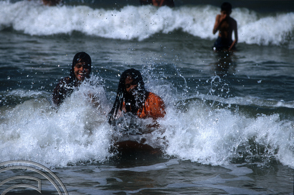 T9520. Girls in the waves. Arambol. Goa India. 05.02.2000