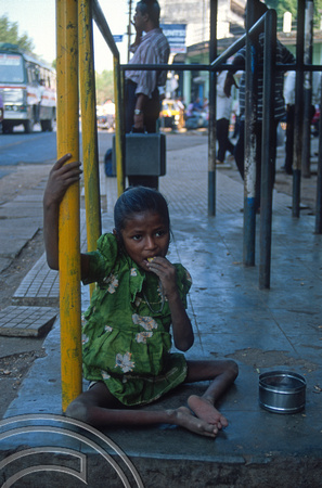 T9606. Girl with polio begging. Margao. Arambol. Goa. India. 09.02.2000